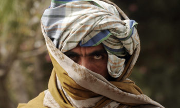 A former Taliban fighter looks on after joining Afghan government forces during a ceremony in Herat province on March 26, 2012. Twelve fighters left the Taliban to join government forces in western Afghanistan. The Taliban, ousted from power by a US-led invasion in the wake of the 9/11 attacks, announced earlier this month that they planned to set up a political office in Qatar ahead of talks with Washington. AFP PHOTO / Aref KARIMI (Photo credit should read Aref Karimi/AFP/Getty Images)