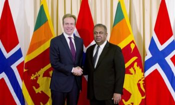 Sri Lankan Foreign Minister Mangala Samaraweera, right, shakes hands with his Norwegian counterpart, Borge Brende, during their meeting in Colombo, Sri Lanka, Thursday, Jan. 7, 2016. (AP Photo/Eranga Jayawardena)