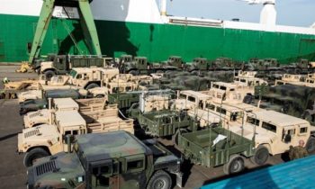 Vehicles stage at the Riga Port A fleet of military vehicles wait in a staging lot after being offloaded from ship in preparation of Exercise Saber Strike 16 in Riga, Latvia, June 4, 2016. Exercise Saber Strike is an annual combined-joint exercise in the Baltic region. The combined training prepares allies and partners to rapidly amass during regional crises and meet their own security needs by improving the security of borders and countering threats.