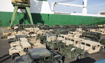 A fleet of military vehicles wait pier side in preparation of Exercise Saber Strike 16 in Riga, Latvia, June 4, 2016. The vehicles were transported by a British Roll-On, Roll-Off ship from Norway for the exercise. Exercise Saber Strike is an annual combined-joint exercise in the Baltic region. The combined training prepares allies and partners to respond more to regional crises and meet their own security needs by improving the security of borders and countering threats.  (U.S. Marine Corps photo by Sgt. Shawn Valosin/Released)