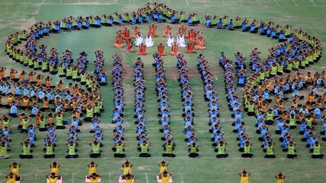 A group of yoga students form a beautiful and colourful shape in Ahmedabad, India, for International Yoga Day on Tuesday.