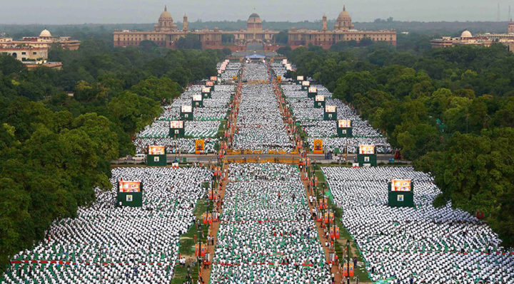 Thousands of participants perform yoga on Rajpath in New Delhi. Prime Minister Narendra Modi hailed the first International Yoga Day as a 'new era of peace', moments before he surprised thousands in New Delhi by taking to a mat himself to celebrate the ancient Indian practice.