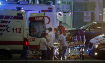 Turkish rescue services gather outside Istanbul's Ataturk airport, Tuesday, June 28, 2016. Two explosions have rocked Istanbul's Ataturk airport, killing several people and wounding others, Turkey's justice minister and another official said Tuesday. A Turkish official says two attackers have blown themselves up at the airport after police fired at them. The official said the attackers detonated the explosives at the entrance of the international terminal before entering the x-ray security check. (AP Photo/Emrah Gurel)