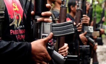 Members of the New Peoples Army (NPA) belonging to the Pulang Bagani Command celebrate the 40th Founding Anniversary of the Communist Party of the Philippines (CPP) somewhere in Davao City on Friday, December 26, 2008. The NPA, which is the armed wing of the CPP, has been fighting for the establishment of the Marxist state in the Philippines since 1968. AKP Images/ Keith Bacongco