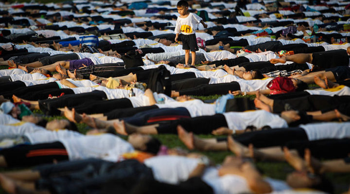 A Malaysian boy is seen playing during the International Day of Yoga festival in Kuala Lumpur, Malaysia