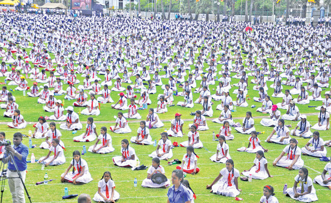 'Surya Namaskar', the sun salutation was demonstrated by 5,000 Jaffna Tamil school children at the stadium, to mark International Yoga Day 