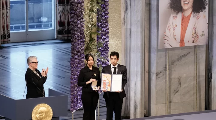 Children of Iranian activist accept her Nobel Peace Prize